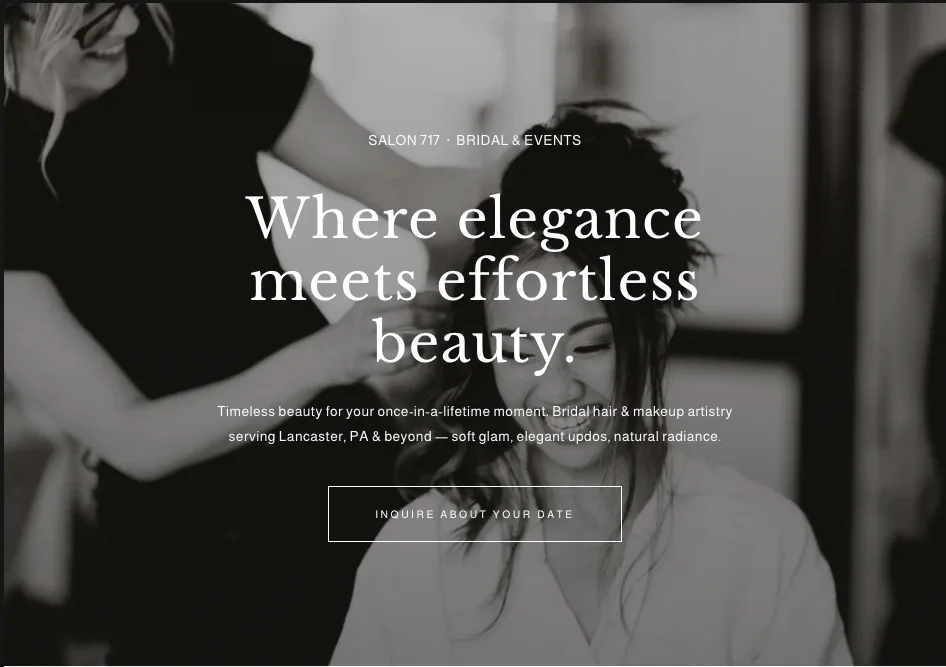Salon 717 homepage: a black-and-white photograph of a bride laughing while her hair is done, headline “Where elegance meets effortless beauty.”